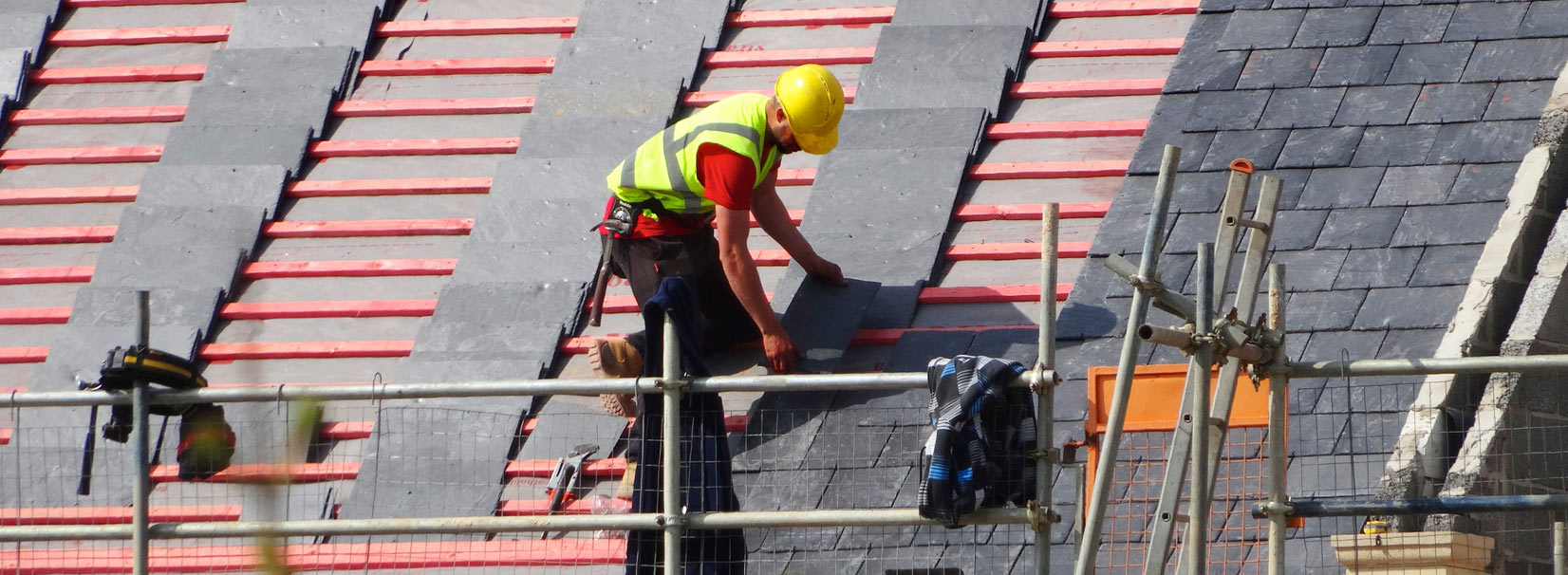 Roofer working on residential roof